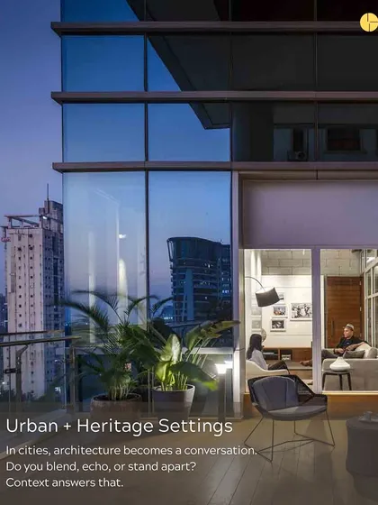 In cities, architecture becomes a conversation with its context. This image, showing a modern glass facade next to older buildings, poses the question: do you blend, echo, or stand apart? Context provides the answer.