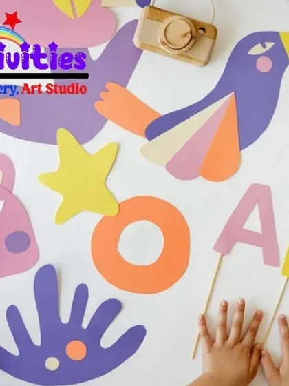 Art is all around us. This flat-lay of colorful paper cutouts shows the kind of creative exploration we encourage. We provide the tools and the space for kids to experiment with shapes, colors, and materials to express their unique ideas.