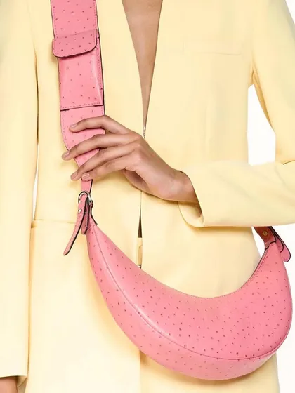 A clean product shot of the Selena in Pink Ostrich. This image clearly shows the unique, dotted texture of the ostrich-embossed leather and the bag's vibrant color.