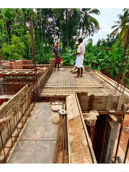 An intense site discussion in progress. We believe in constant on-site collaboration with the construction team to resolve details and ensure every aspect of the design is executed to our standards.