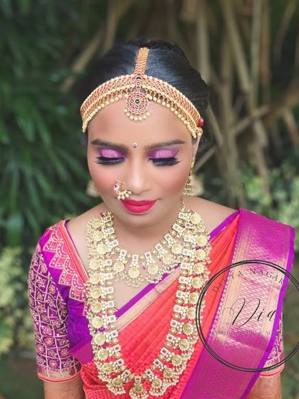 A top-down view showcasing the vibrant pink and purple eyeshadow that I matched to her saree's border. This angle highlights the precision of the eye makeup and the traditional nose ring, which are key elements of her bridal look.