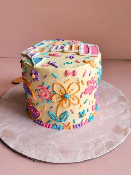 It's all in the details. We pour our hearts into decorating each cake, like this colorful creation for Theo. From tiny paw prints to flowers and rainbows, every element is handcrafted and completely edible for your pet.