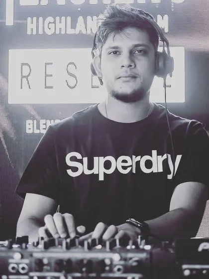 A focused portrait of me at the decks, ready for another big weekend.