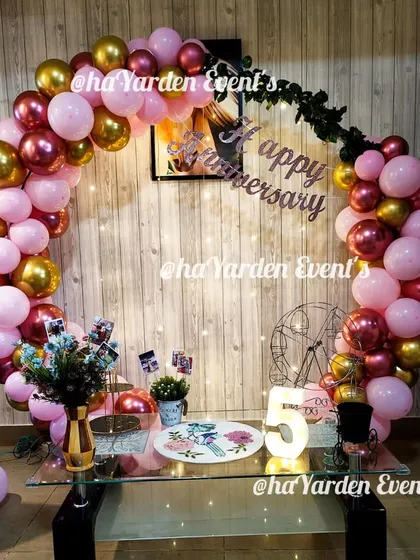 Another view of the pink and gold anniversary ring, showing the 'Happy Anniversary' banner and a light-up number '5'.