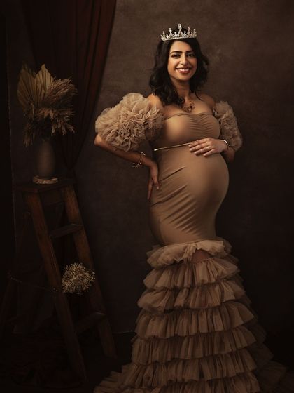 Adding a simple crown transforms the portrait, elevating it to a truly royal and celebratory image of motherhood.