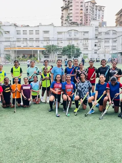 Our girls' team posing for a group photo after a Saturday practice session. Their teamwork and camaraderie are evident on and off the field.