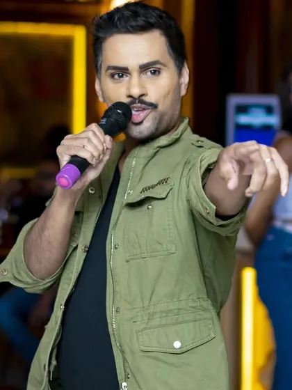 As your MC, my job is to engage directly with you. Whether I'm cracking a joke, announcing the next singer, or pulling you onto the dance floor, I make sure everyone feels like part of the show.