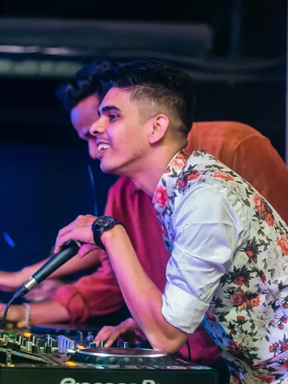 On the mic, connecting with the crowd at a festival. It's not just about playing the bangers.
