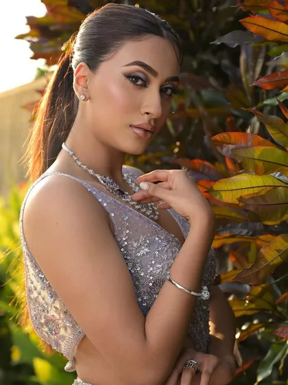 The classy and unstoppable look captured in natural light. The makeup remains flawless and impactful, showcasing its versatility.