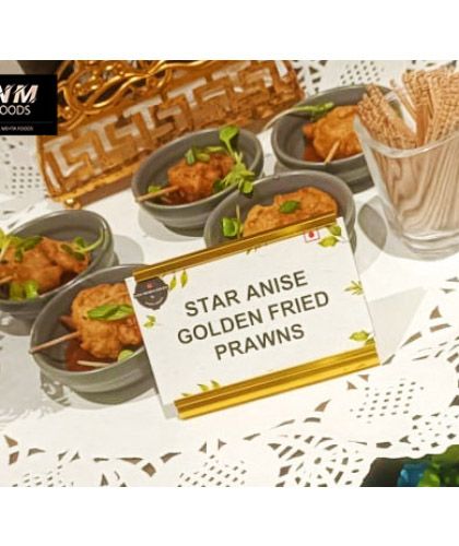 Star Anise Golden Fried Prawns, a delicate and aromatic seafood starter. The name card indicates our practice of clearly labeling each dish for the convenience of your guests.