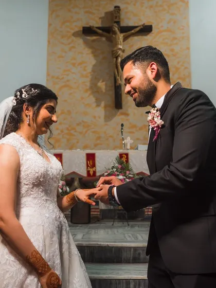 A promise being sealed with a ring during Shreya and Wayne's beautiful church wedding. We capture the sanctity and intimacy of the vow exchange.