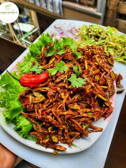 A platter of seasonal yongchak singju, or stink bean salad. This is a very popular and unique Manipuri snack, available only in season.