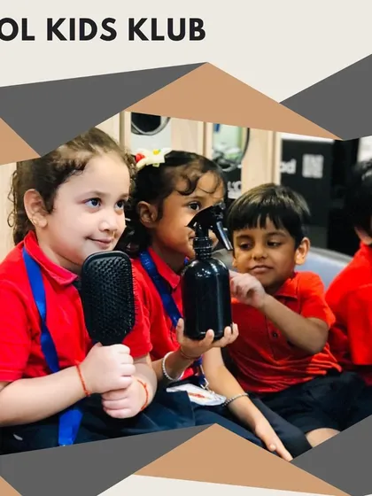 Children curiously playing with salon tools like brushes and spray bottles under supervision, making the experience interactive and fun.