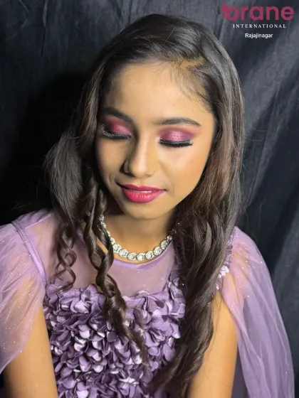 A soft, smiling pose that shows how this glam look is perfect for evening parties and photos.
