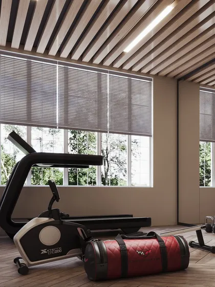 A home gym in a London residence, visualized with a focus on functionality and modern aesthetics. The render showcases the rowing machine and other equipment in a bright, motivating space.