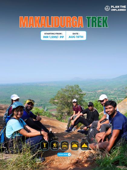A group relaxes at the summit of Makalidurga, enjoying the views on this Independence Day weekend trek.
