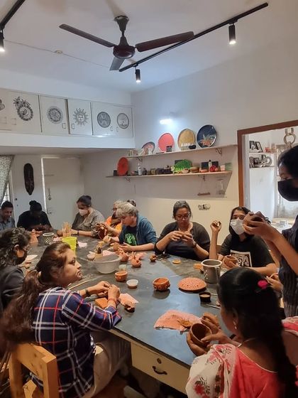 An instructor provides guidance during a busy group workshop. We ensure everyone gets the help they need to bring their ideas to life.