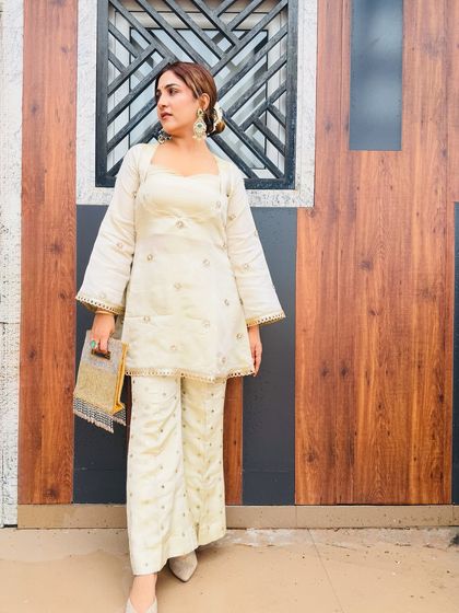 My festive look for Rakhi. This off-white co-ord set with subtle gold embroidery is paired with statement earrings and a sleek bun for a look that is both traditional and modern.