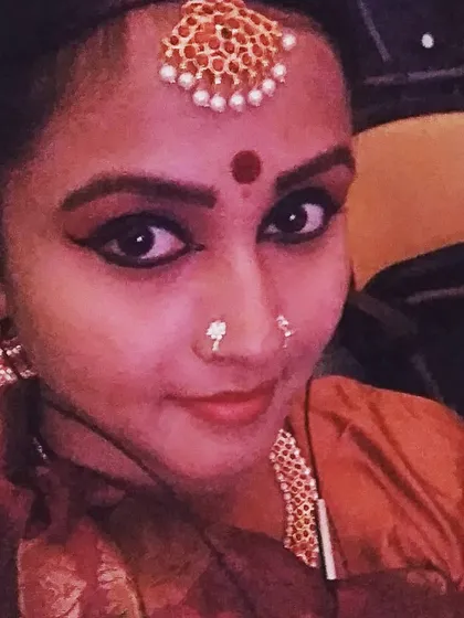 Another look at the traditional costume and makeup for a Bharathanatyam performance. The details, from the bindi to the headpiece, are essential to the storytelling of this ancient art form.
