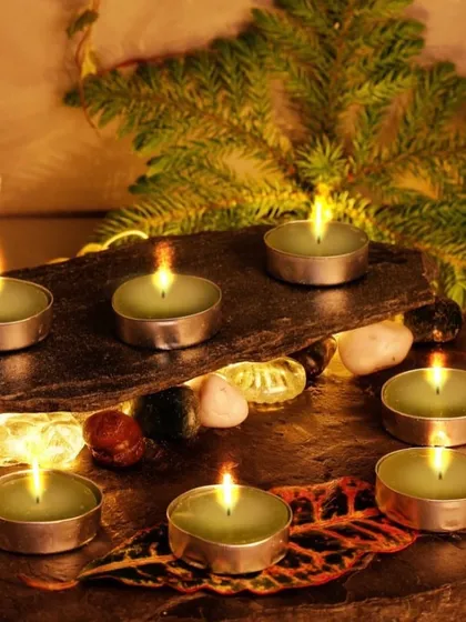 Create a cozy and serene ambiance with our long-lasting tealight candles. This lifestyle setting shows how our simple green tealights can transform a space, providing a gentle flame and warm light for hours.