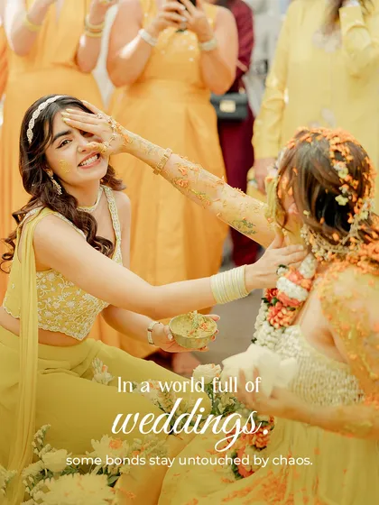 In a world full of weddings, some bonds stay untouched by chaos. A playful moment between the bride and her bridesmaid during the haldi ceremony.