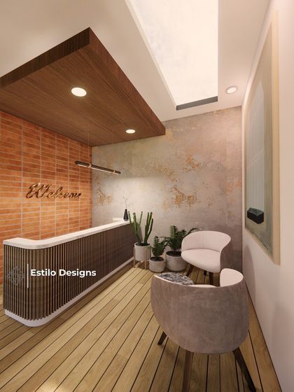 This is the reception area for a clubhouse project, designed to be warm and welcoming. The space combines a brick accent wall, wood flooring, and a slatted reception desk to create a rustic yet modern feel.