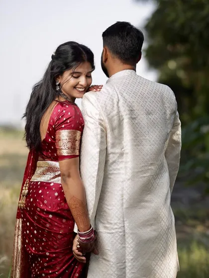 A romantic pose from Shruti's engagement shoot. Her half-up hairstyle and glowing makeup look beautiful from the back, showing the importance of 360-degree styling.