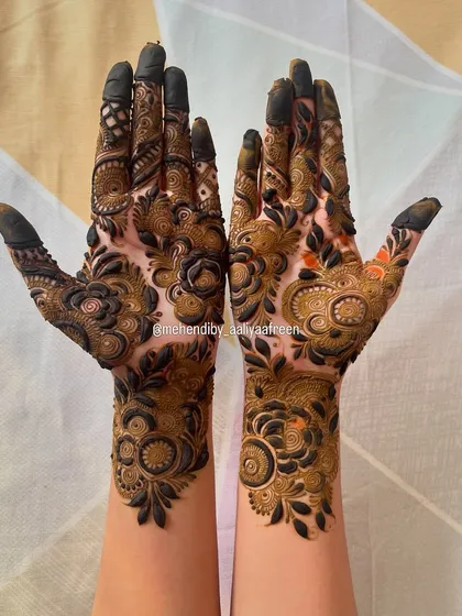 Another angle of the heavy floral design, showing the intricate details on the fingers and palm.