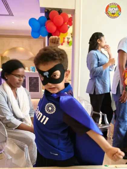 At my Superhero Academy, every child gets to be a hero. Here, a young hero proudly shows off the mask he designed and created, ready to test his newfound powers in a series of fun, science-based challenges.