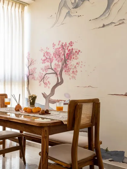 A close-up of the dining area, set against the beautiful hand-painted cherry blossom mural. This feature turns every meal into a special occasion.