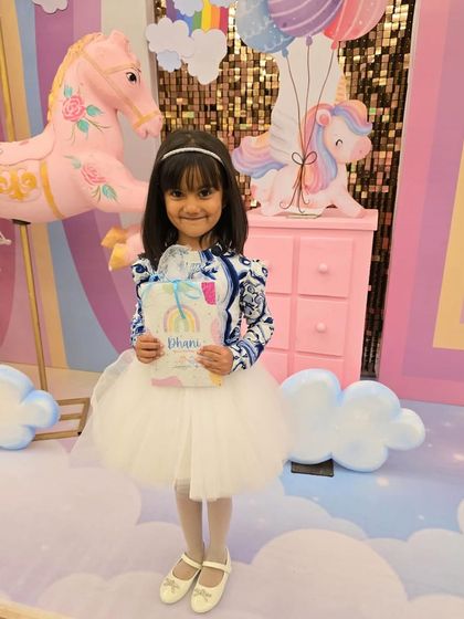 This little one, surrounded by unicorns and rainbows, is the picture of happiness. Thank you for making us a part of your celebrations!