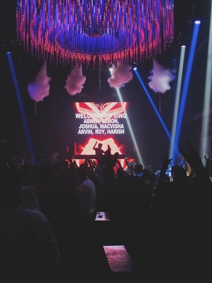A wide shot of the stage at SinQ during a corporate event.