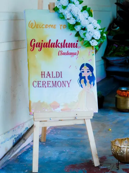 A close-up of the personalized welcome sign for the Haldi ceremony. It's the small, thoughtful details that make a wedding unique.