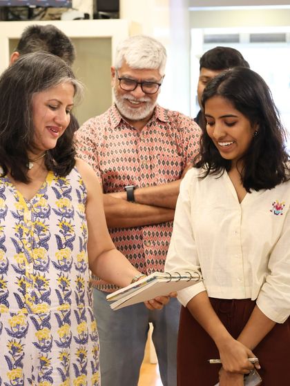Our Director Curatorial, Archana Shenoy, engages with a young artist from the @uskbengaluru group, discussing her sketch and the artworks that inspired it. These interactions are at the heart of our community.