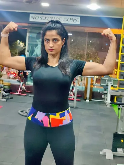 Commit to be fit. This pose isn't just for show; it's the result of countless hours spent lifting, pushing, and pulling to build strong biceps and a powerful upper body.