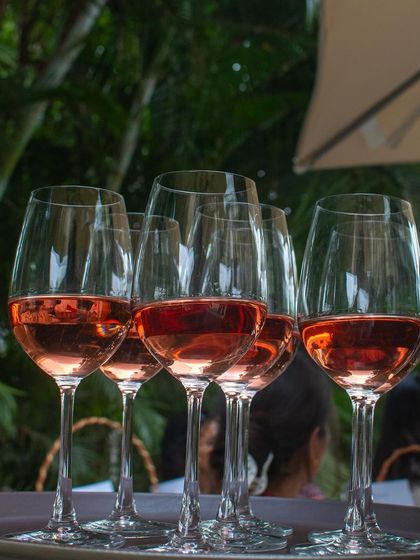 A tray of rosé wine glasses, ready to be served to our guests at the Wine Picnic.
