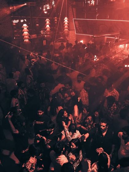 The red lighting at Boho creates a fiery and passionate atmosphere on the dancefloor.