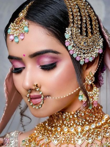 This close up shows the detail of the pink eyeshadow, blended to perfection. The pastel tones in the jewelry are echoed in the makeup for a cohesive look.