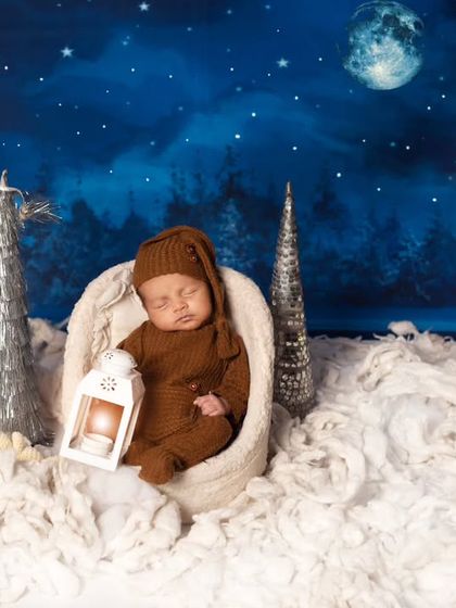 In this variation, the baby holds a small lantern, adding a warm glow to the magical night scene. We love adding small details to make each photo unique.