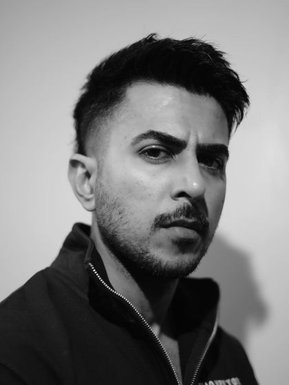 The mullet is back and better than ever. This modern take on the classic style features a sharp fade on the sides and textured length in the back.