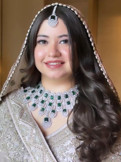 Priyal's smile shows how confident and beautiful she felt. This look is a perfect example of my signature dewy, minimal style for the modern bride.