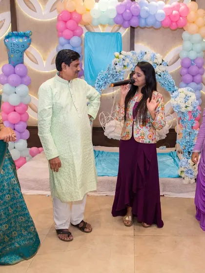 Engaging with the grandparents during Parv's naming ceremony. Their joy and blessings are the most important part of these traditional family gatherings.