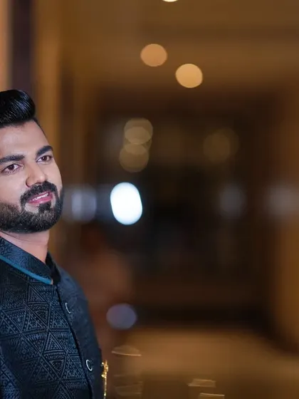 A close-up of the engagement look. The hairstyle is sharp, and the beard is perfectly groomed to complement the outfit.
