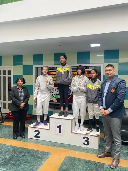 The winners' podium for one of the U-18 girls' events, with our fencers taking the top spots.