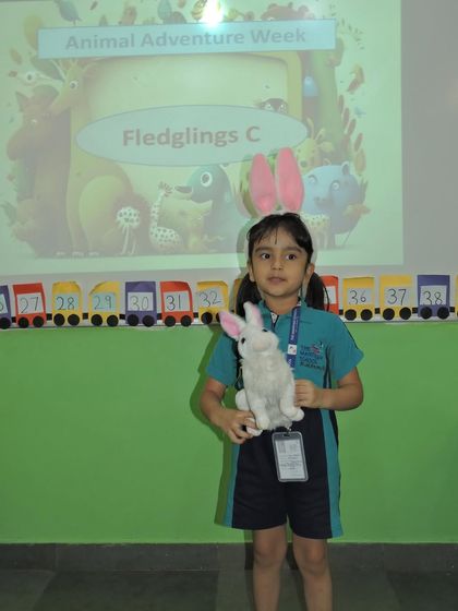 A student participates in "Show and Tell" during Animal Adventure Week. This activity helps build public speaking skills and allows children to share their interests with their peers.