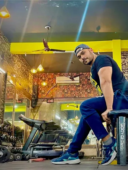 A candid shot in the gym. This is my element, surrounded by the tools of the trade.