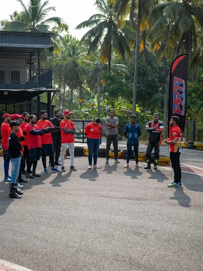 A full group briefing on the track. I make sure everyone, from students to crew, is on the same page before the engines start.