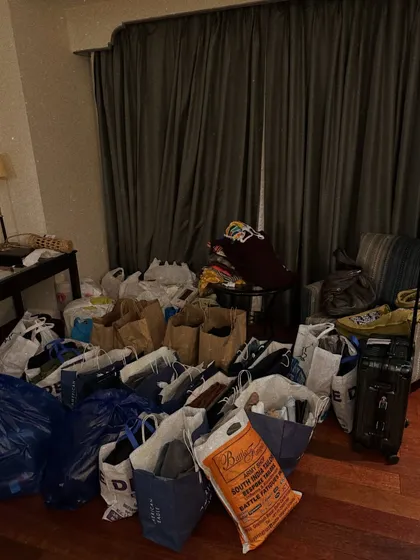 The aftermath of a successful sourcing day. My room filled with shopping bags is a common sight. This is the beautiful chaos of bringing a wedding wardrobe together.