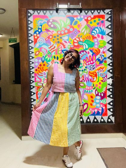 Wore this beautiful striped, multi-color dress today and I absolutely love the fabric and the way it plays with the colors in my mural behind me.