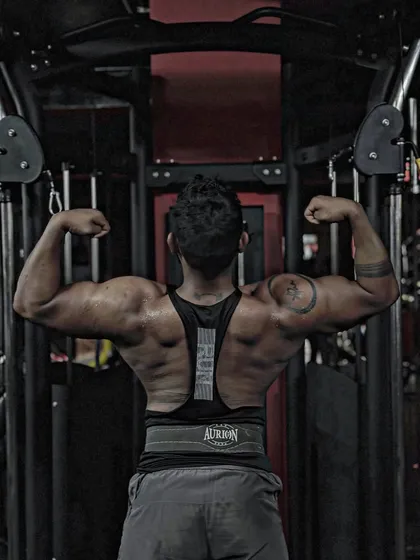 Spread your wings. A classic lat spread pose, showing the width of my back. This pose is all about creating an illusion of size.